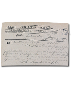 handwritten telegram in scrapbook. “Buckingham Palace. Nursing Section Mina Mowat. No 11 Can Gen Hosp Moore Shorncliffe. Your attendance is required at Buckingham Palace on Wednesday next the seventeenth inst at ten ock indoor uniform with gloves please telegraph acknowledgement. Lord Chamberlain Ldn.” The caption in the scrapbook is “Telegram from the Lord Chamberlain requesting attendance of Wilhelmina Mowat at Buckingham Palace where she was invested with the Royal Red Cross by His Magesty King George.”