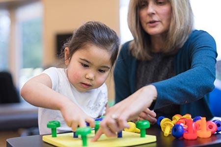 Ocupational Therapist working with small child