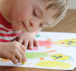 child colouring a picture